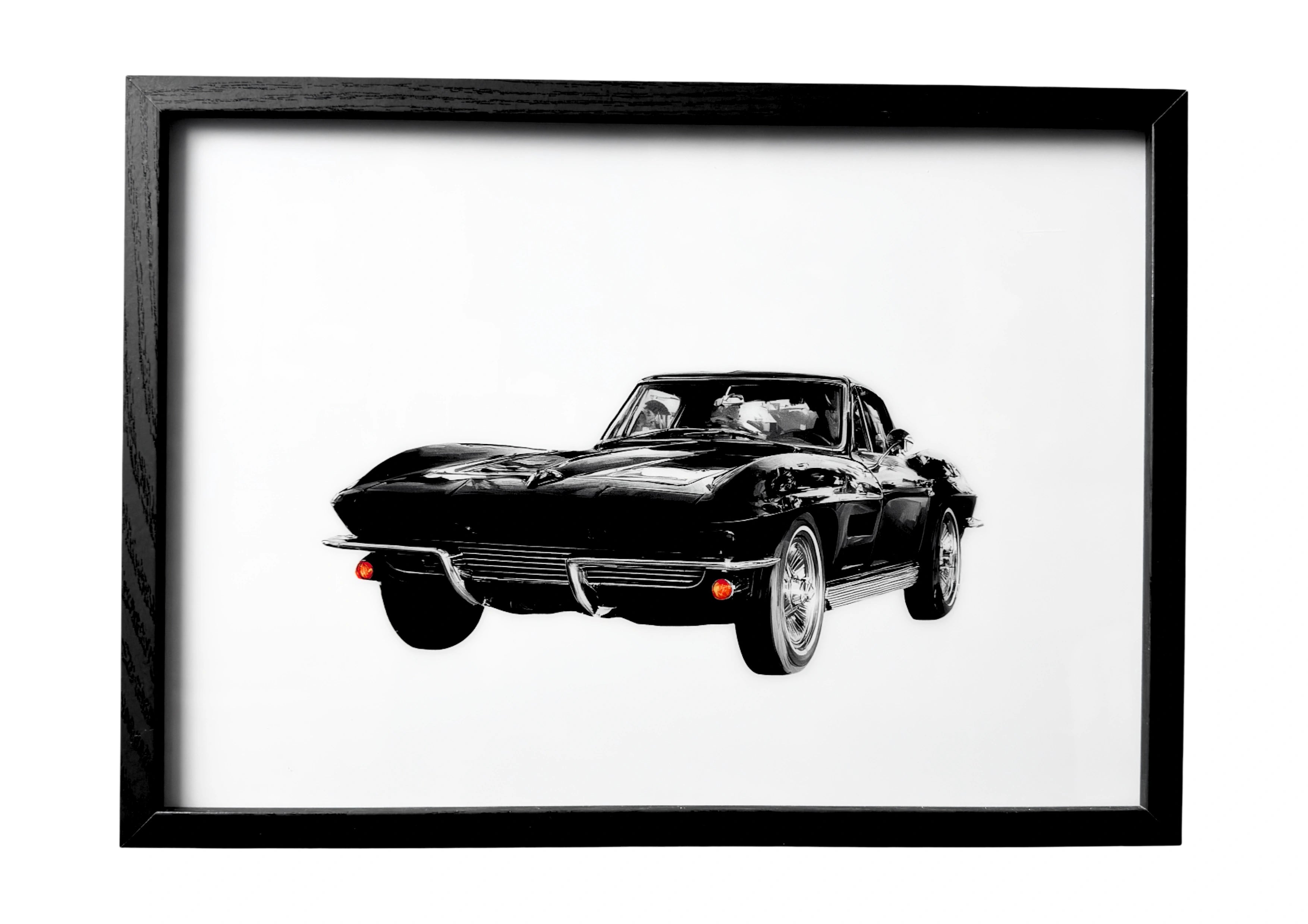 Minimalist black 1963 Chevrolet Corvette Sting Ray wall art resting on a Miami boulevard with palm silhouettes and pastel buildings. A serene automotive classic.