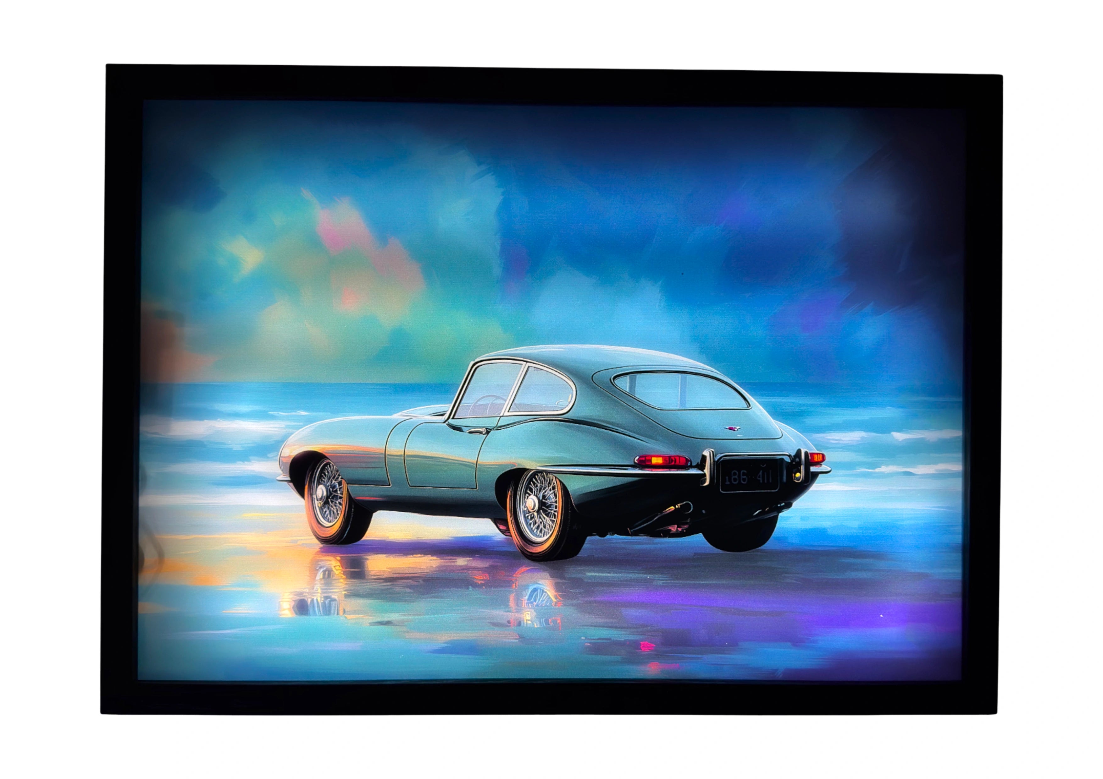 Jaguar E-Type 1961 LED light up wall art glowing in racing-green reflection beneath teal and bronze light. A luminous tribute to timeless design.
