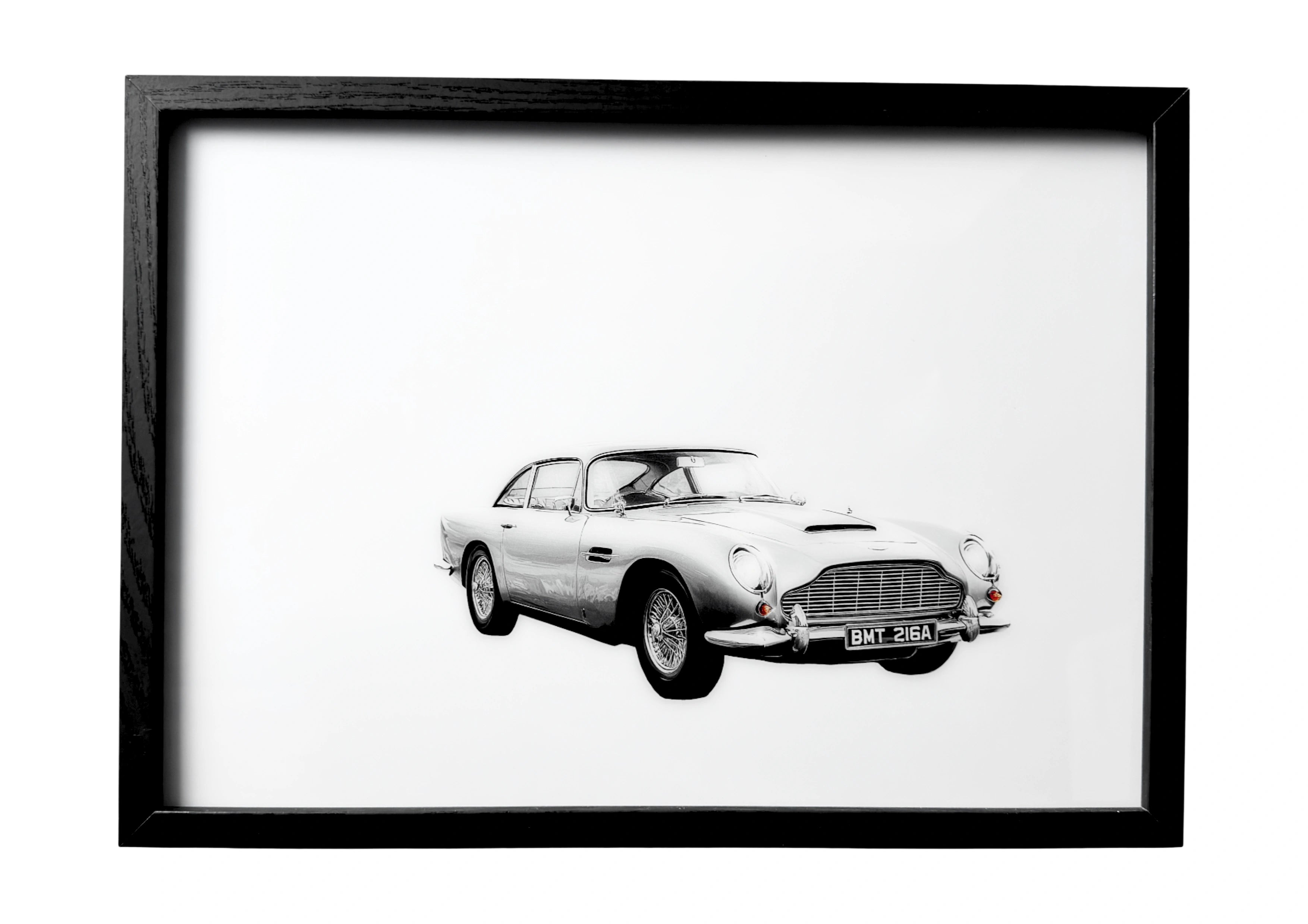 Aston Martin DB5 wall art in refined grayscale stillness. A framed celebration of British automotive excellence.