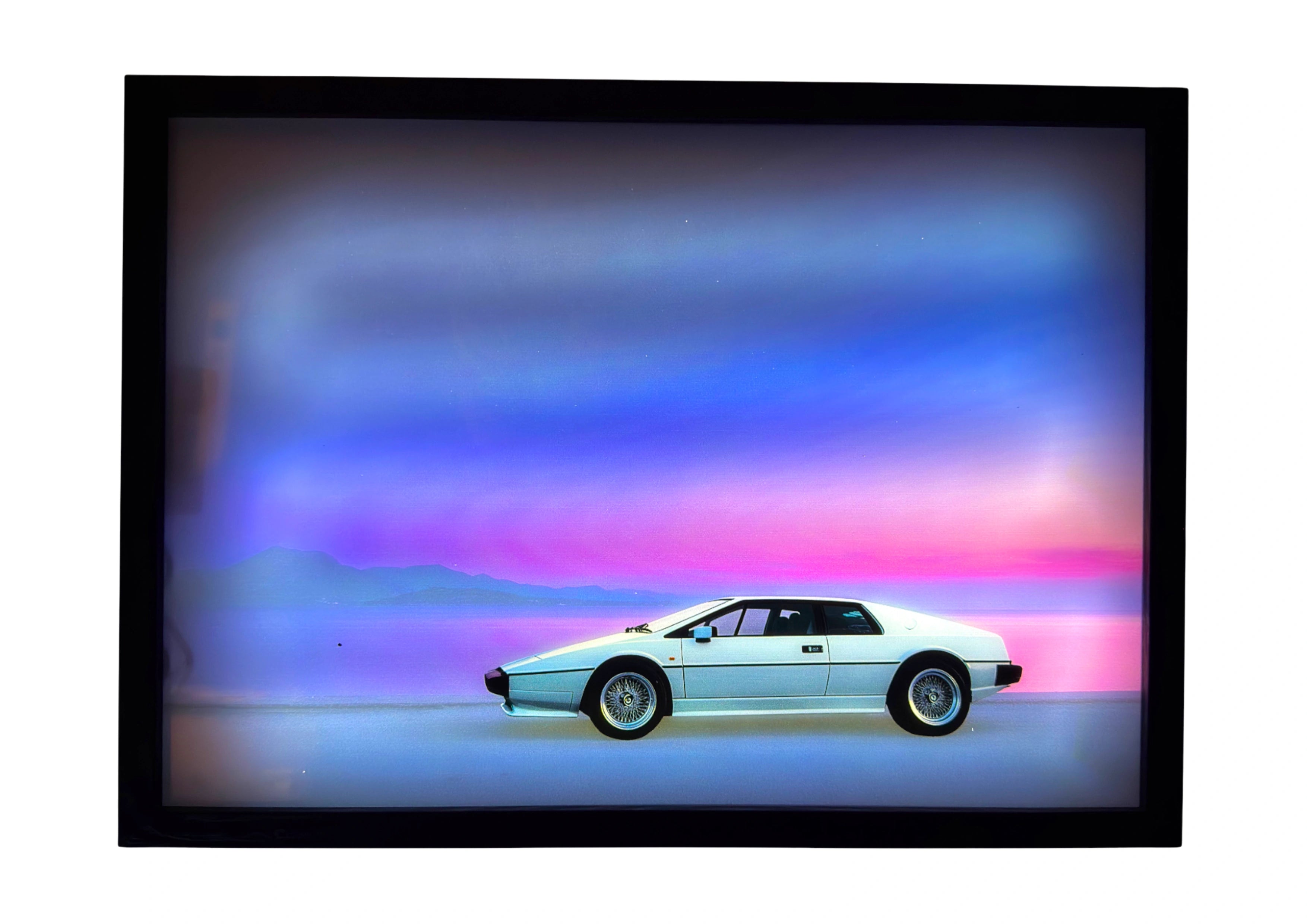 Lotus Esprit 1976 LED light up wall art glowing under violet and deep blue twilight, capturing calm cinematic precision.