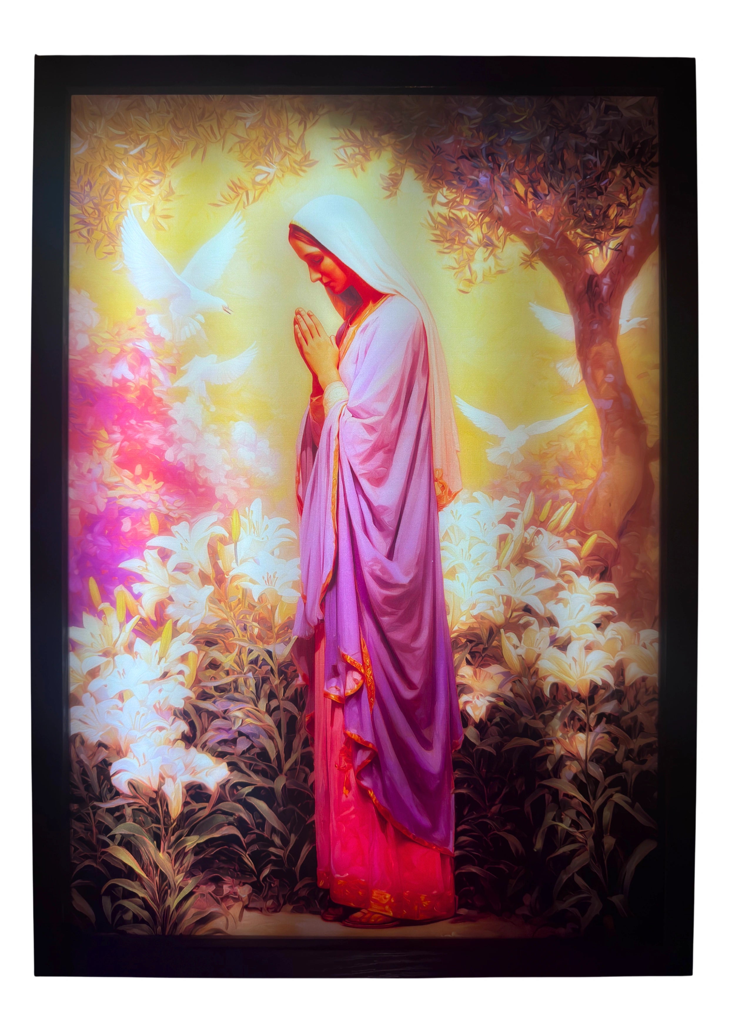 The Virgin Mary LED light up wall art glowing in sunstone light through olive leaves — a serene vision of faith and divine warmth.