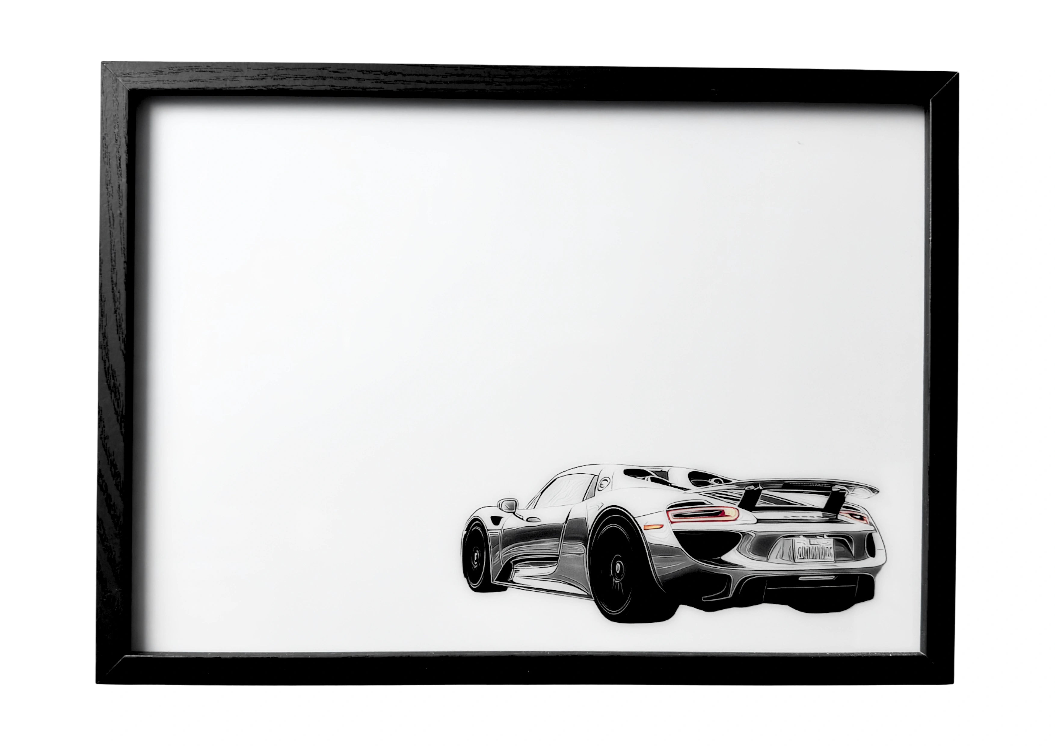 Porsche 918 Spyder wall art rear three-quarter view in metallic silver with black spoiler and twin exhausts. A framed celebration of German performance design.
