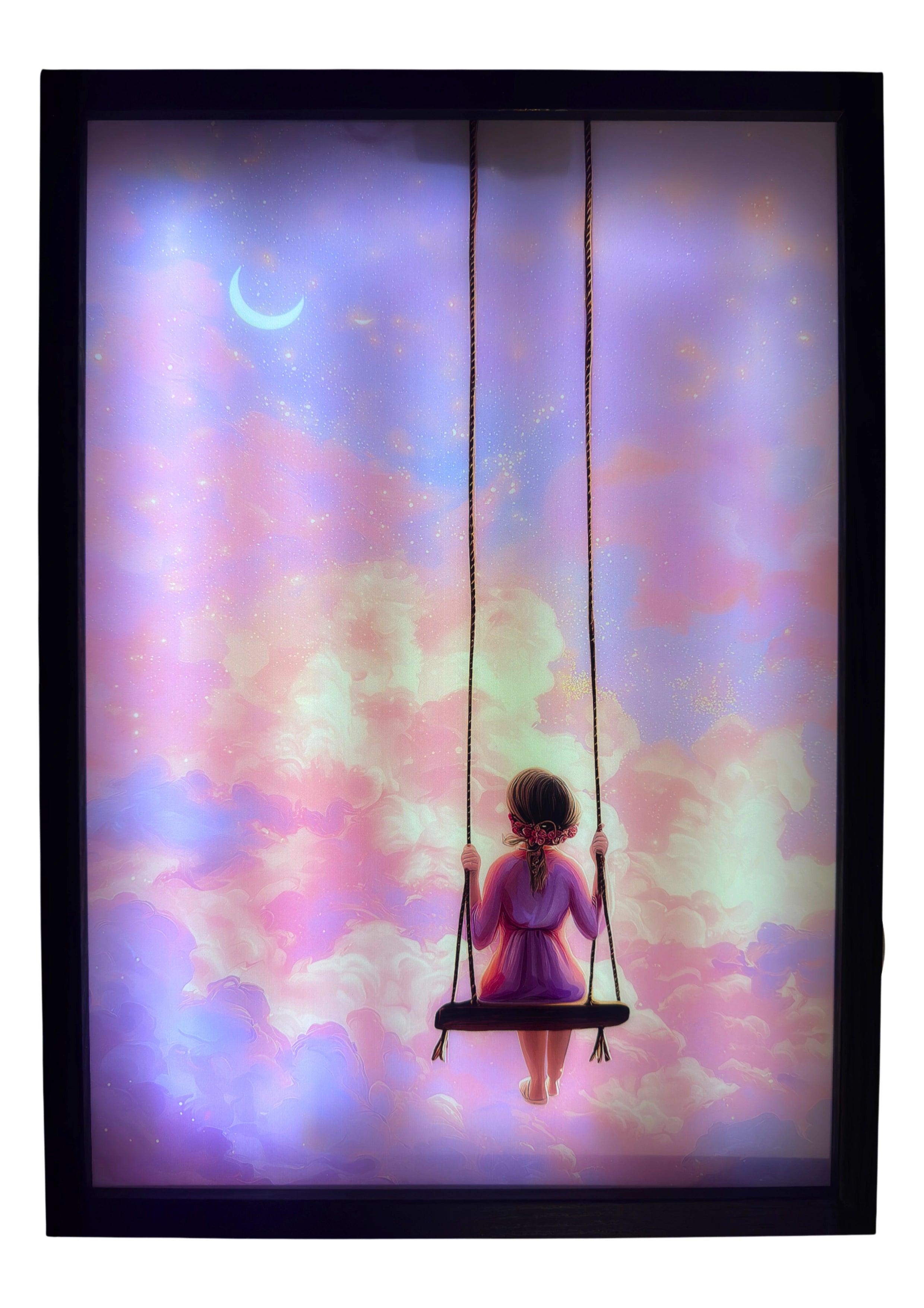 Girl on a swing LED light up wall art glowing among pink and golden clouds beneath a crescent moon. A magical dreamscape for nursery enchantment.