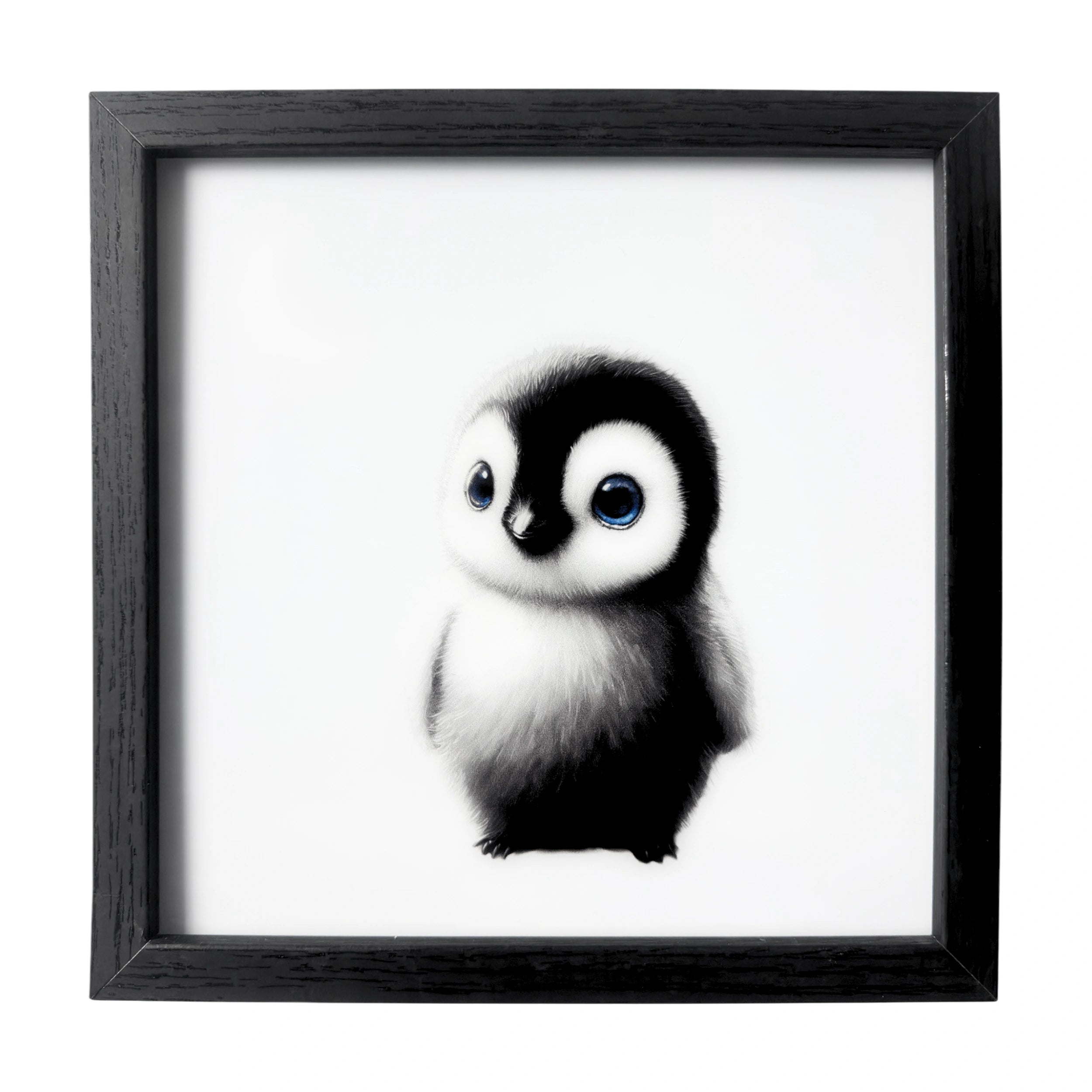 Minimalist baby penguin wall art with deep blue eyes. A framed gentle nursery companion.