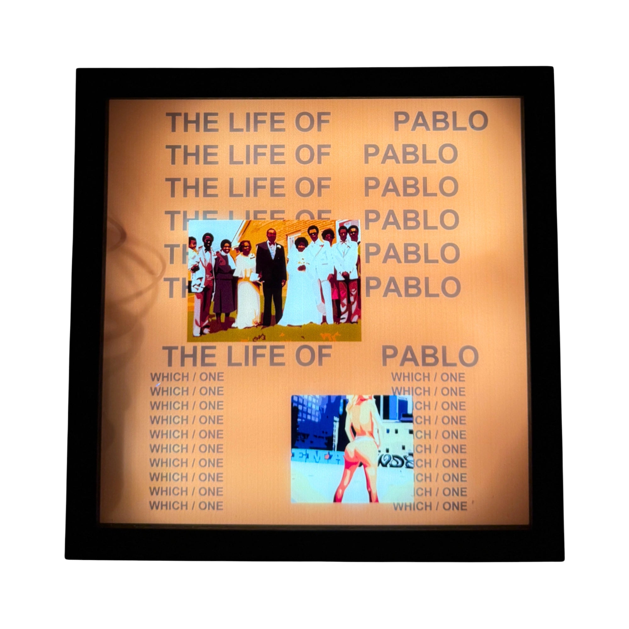 Light-up touch-sensitive LED wall art of Kanye West's The Life of Pablo album cover, illuminated by a vivid orange background, in a neutral black frame.